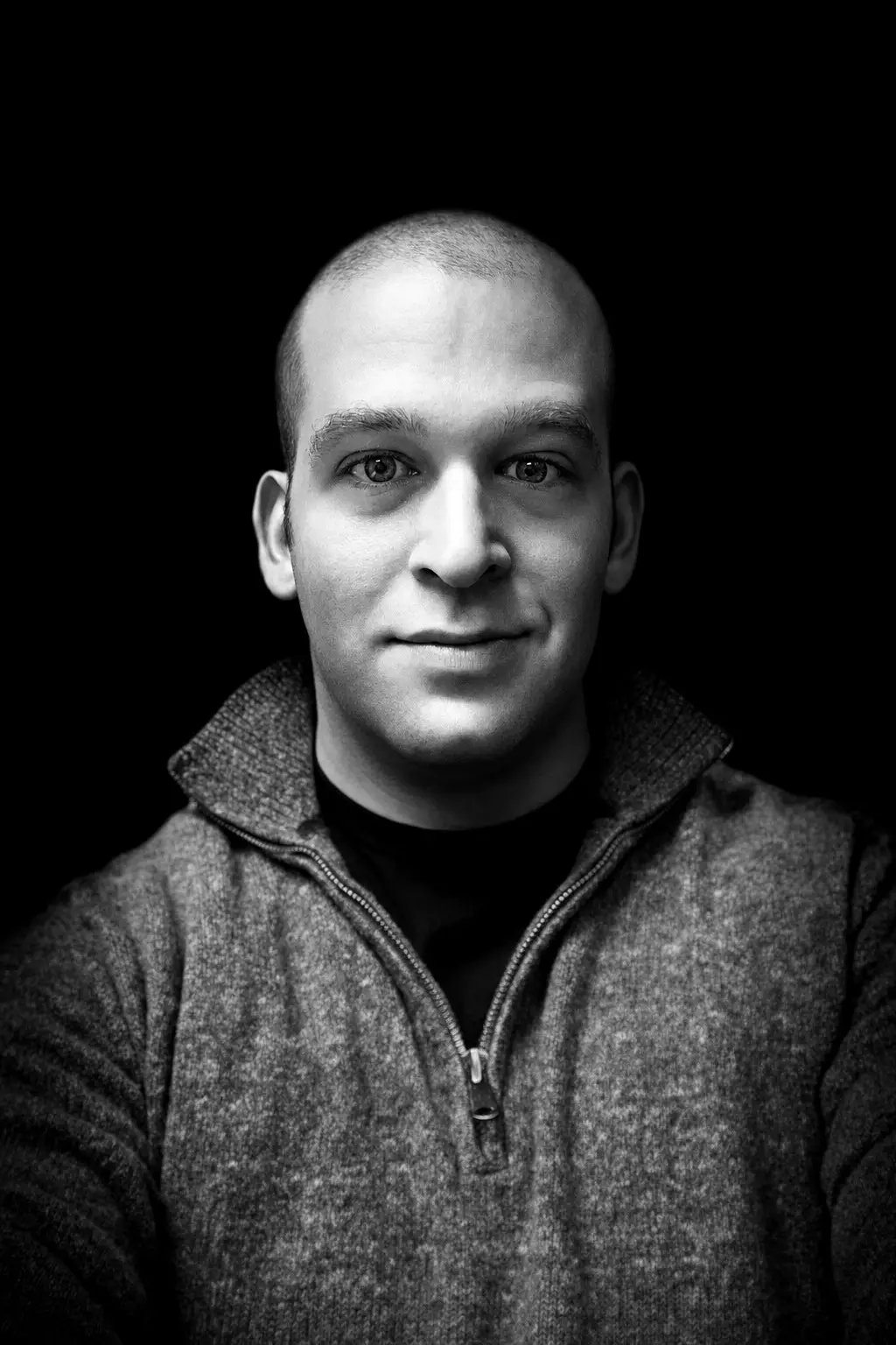 Black-and-white portrait of Tim Katz against a black background